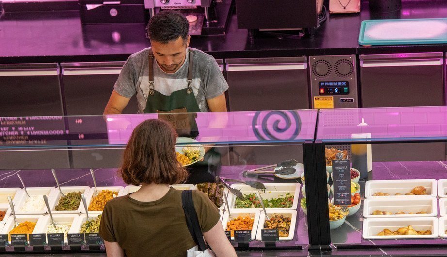 Women ordering food at a food stand